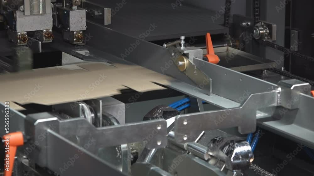 Machines for the production of paper containers or packaging, for further use in the food industry.
