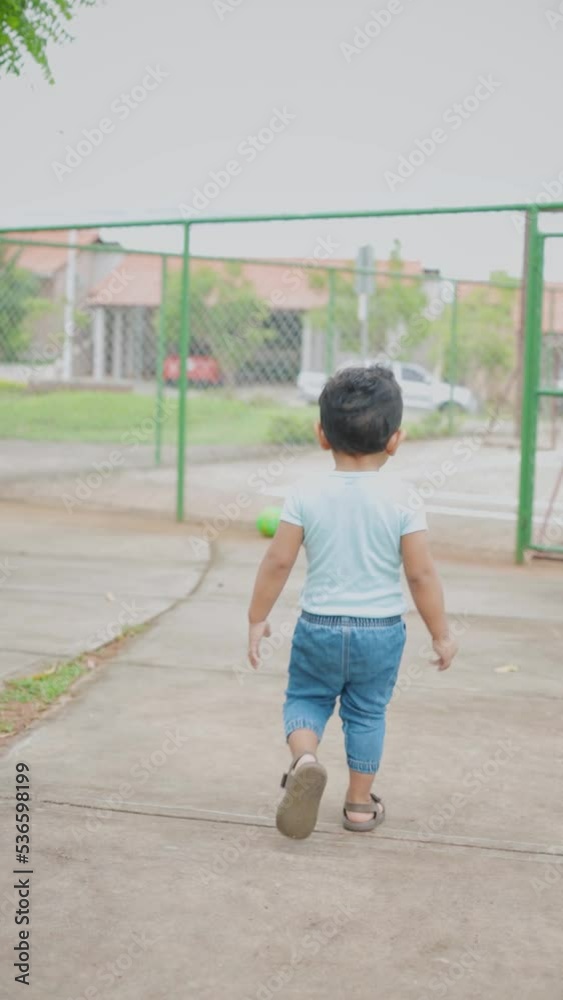 latin baby walking backwards on the trail, general shot latin baby walking backwards on the trail, general shot