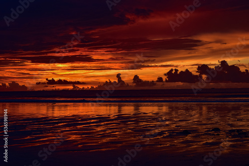 Landscape of sunset at Chaung Tha beach. Cloudy sky. Ending hour at seaside.