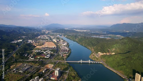 aerial view of modern cityscpae by fuchun river in blue sky photo