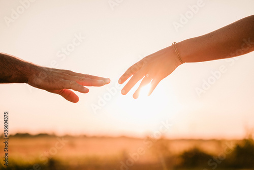 couple almost holding hands