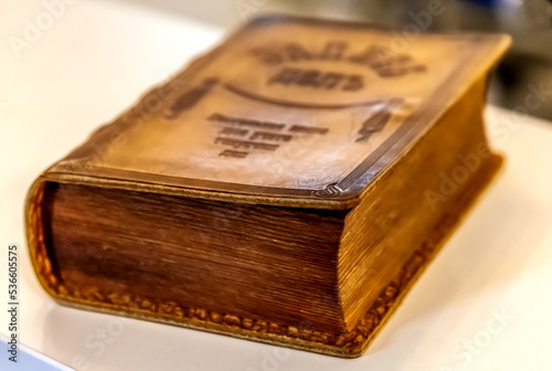 Leather-bound book close-up on a white background