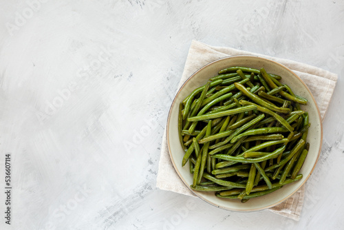 Homemade Sauteed Green Beans on a Plate, top view. Flat lay, overhead, from above. Space for text.