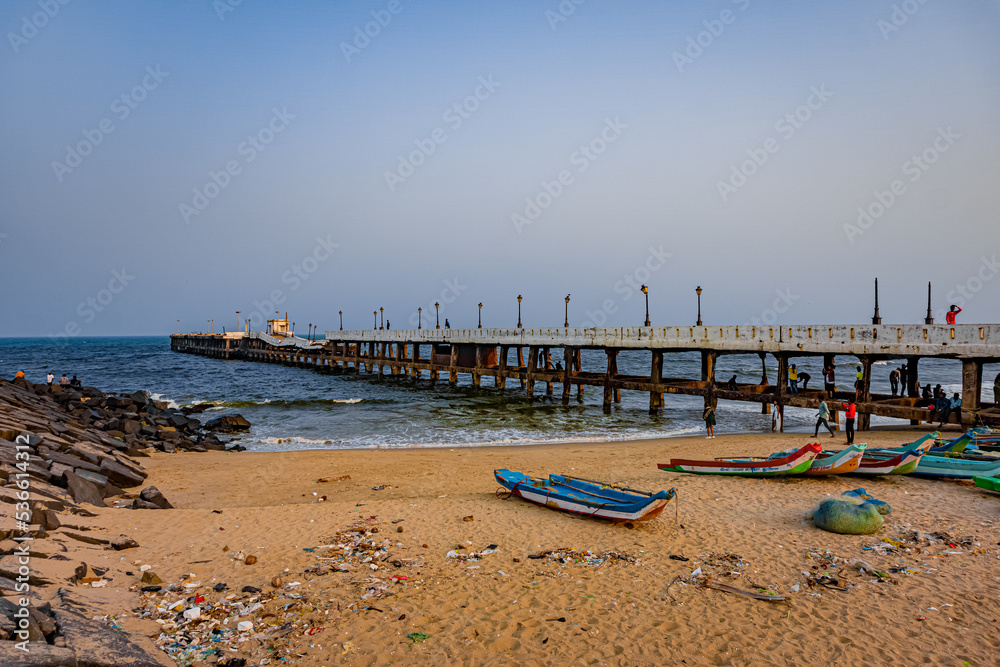 Obraz premium The Rock Beach of Pondicherry or Puducherry, also known as Promenade Beach or Gandhi beach, is an exceptional place where the shore is densely populated by majestic rocks. At Tamilnadu, South India.