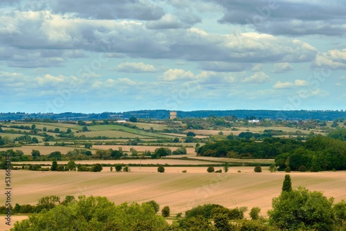 Scenic view from the Chiltern hills looking towards an open field on a sunny day photo