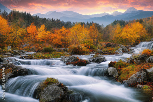 beautiful waterfall in autumn forest