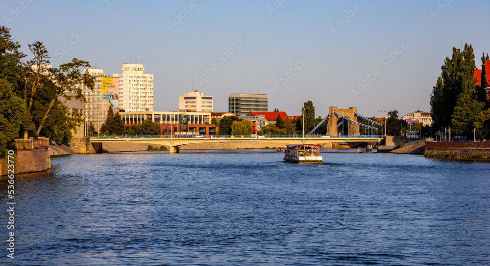 Panoramic view of Wrocław, Poland downtown with Peace Bridge Most Pokoju over Odra river seen from historic old town quarter.