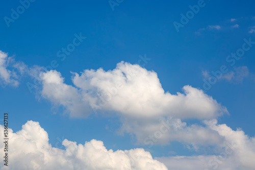 Landscape of the blue Sky and white cloud during day. Beautiful clear cloudy in sunlight calm season. Cloudy sunny sky in morning. Heaven background with big clouds with soft light from the sun.