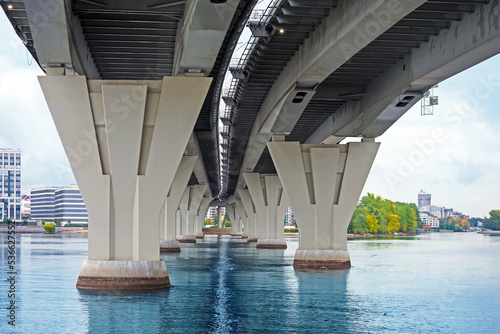 Bridge piers  perspective in St Petersburg  Russia. Bottom view of concrete pillars of the bridge over the river