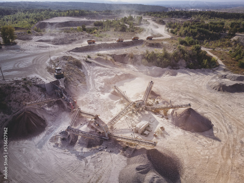 Aerial view of crushed stone quarry machine at work.