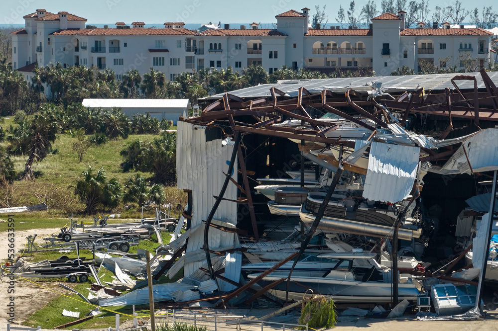 Hurricane Ian destroyed boat station in Florida coastal area. Natural disaster and its consequences