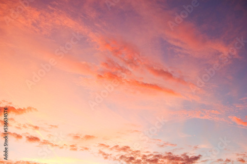 Orange clouds against evening sky. © MagdaWygralak