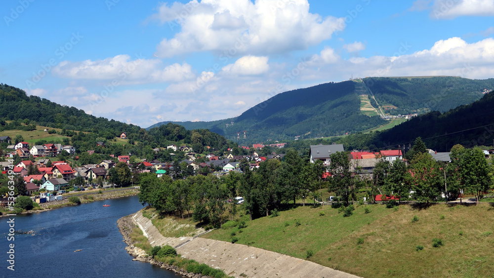 Summer lanscape view from Tresna Dam to Beskid mountains with Sola river and Zar Mount, Poland