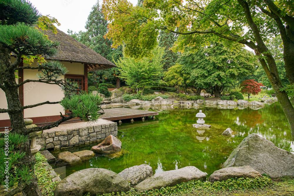 A teahouse and pond and lantern and reflections in the Japanese garden of the Botanical Garden 