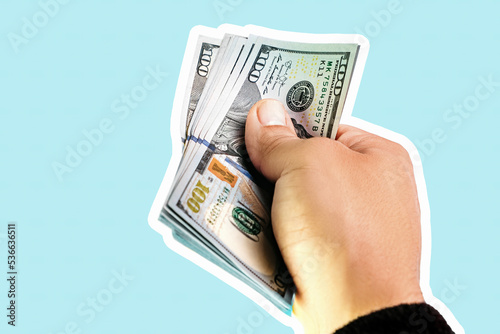 Hand holding american dollars, close up collage on blue background. Modern design, contemporary art collage.