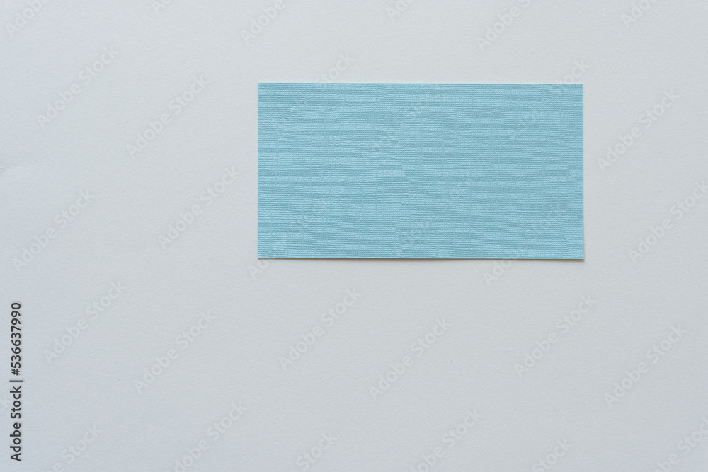 blue paper card with texture on blank paper background blue paper card with texture on blank paper background