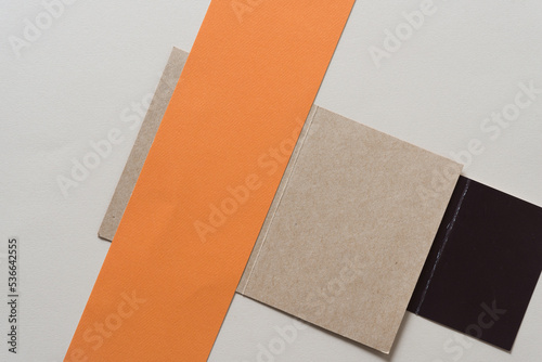 paper background with orange, plain brown, and black elements