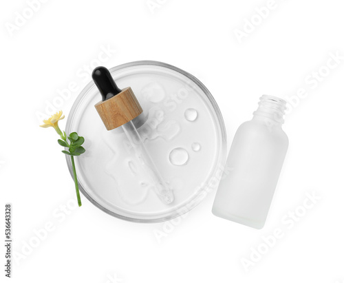 Petri dish with cosmetic product and flower on white background, top view