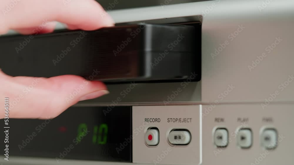 Old video recorder close-up, VHS. Retro player, vintage video cassette broadcasting, audio tape. Old video recorder close-up, VHS. Retro player, vintage video cassette broadcasting, audio tape.