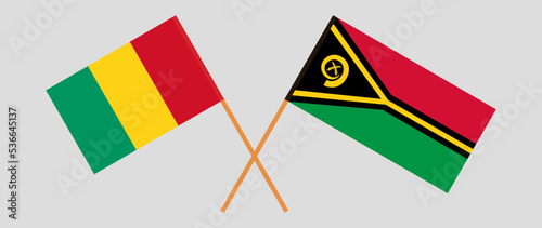 Crossed flags of Guinea and Vanuatu. Official colors. Correct proportion