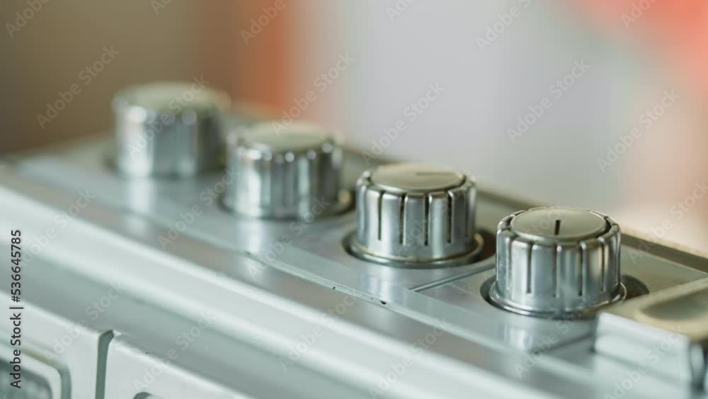 Retro radio tape recorder, audio cassette playing close-up. Listening to music, recording studio old radio boombox player, searching channel, volume. Retro radio tape recorder, audio cassette playing close-up. Listening to music, recording studio old radio boombox player, searching channel, volume.
