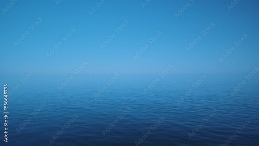 Wide blue ocean view water passing by clear sky 4K