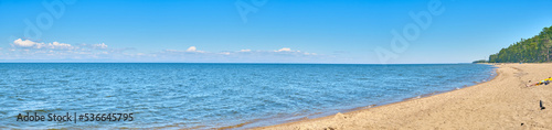 Lake Baikal coast, hill with forest, water bay. Summer travel, discovery of beauty of Earth. Siberia, Russia.