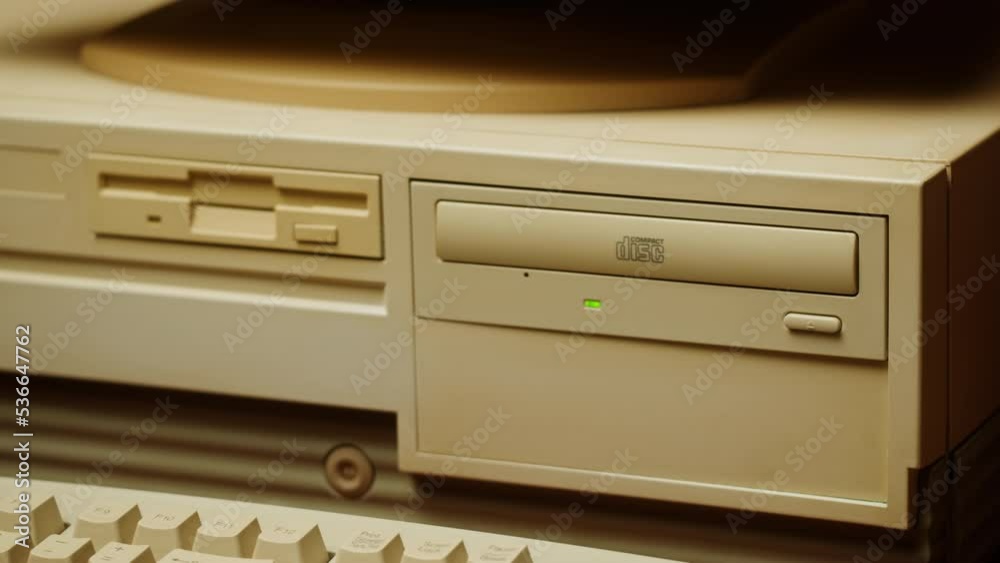 Using CD circle disk for old computer. Dvd player, disc drive. Music recorder, playing retro computer games. Using CD circle disk for old computer. Dvd player, disc drive. Music recorder, playing retro computer games.