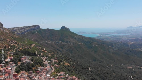 Sardinien Insel in Italien in Europa im Überflug in 4k die mediterrane Stadt Baunei aus Vogelperspektive mit Bucht Meeresblick im Überflug photo
