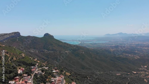 Sardinien Insel in Italien in Europa im Überflug in 4k mit Bucht Meeresblick und mediterraner Stadt Baunei photo