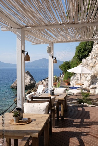 Fototapeta Naklejka Na Ścianę i Meble -  Neat little restaurant in Fethiye, Turkey with tables and chairs outside by the sea