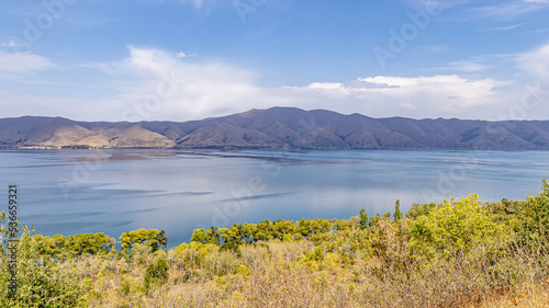 Big mountain lake Sevan in Armenia under a blue sky with clouds