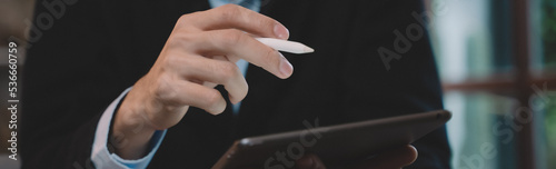 Banner background of Businessman are sitting and happy at cafe. Man using internet and technology by tablet, laptop and smartphone for business, working, communication, studying and job.