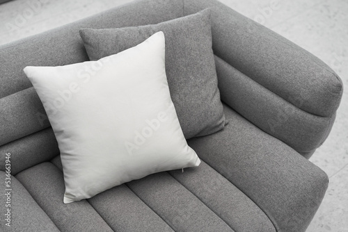 Beautiful white pillow mockup couch with modern interior background photo