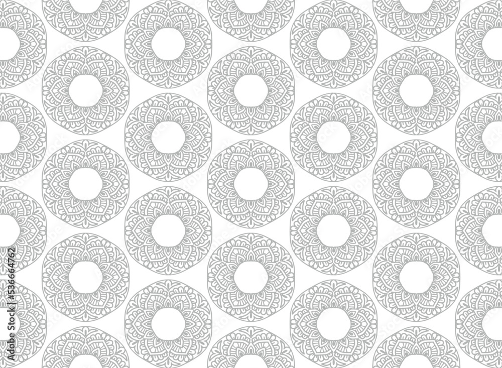 Ethnic decorative gray floral mandala pattern on white background Ethnic decorative gray floral mandala pattern on white background