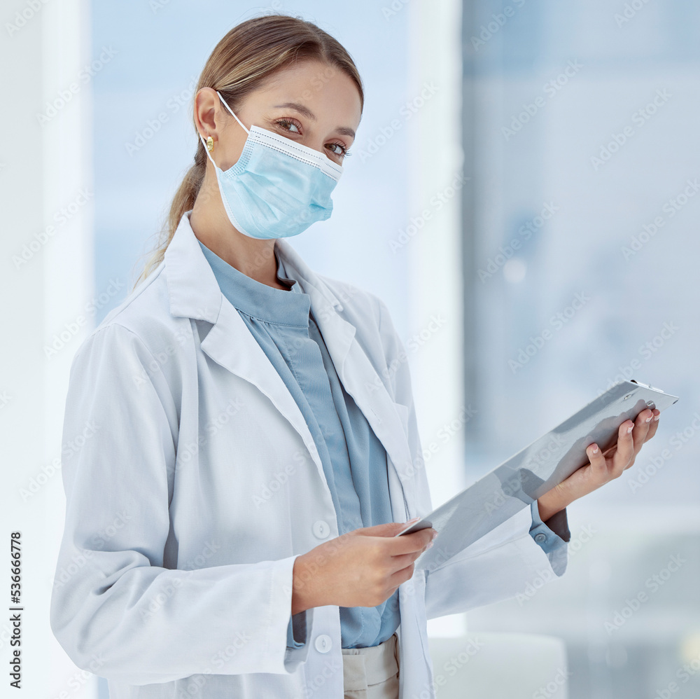 Doctor with covid face mask and a checklist for compliance, risk management and medical insurance. Portrait of a healthcare woman expert with corona virus innovation planning in a hospital or clinic Doctor with covid face mask and a checklist for compliance, risk management and medical insurance. Portrait of a healthcare woman expert with corona virus innovation planning in a hospital or clinic