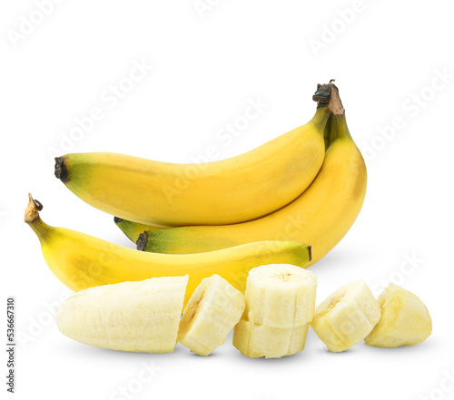 Bunch of ripe yellow bananas and slices, isolated on white background.