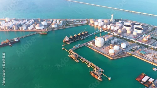 Aerial view of Oil refinery of business logistic sea going ship, the natural gas pipeline for oil delivery ships. to Port of europe-Cargo ship import export, international order concept. 