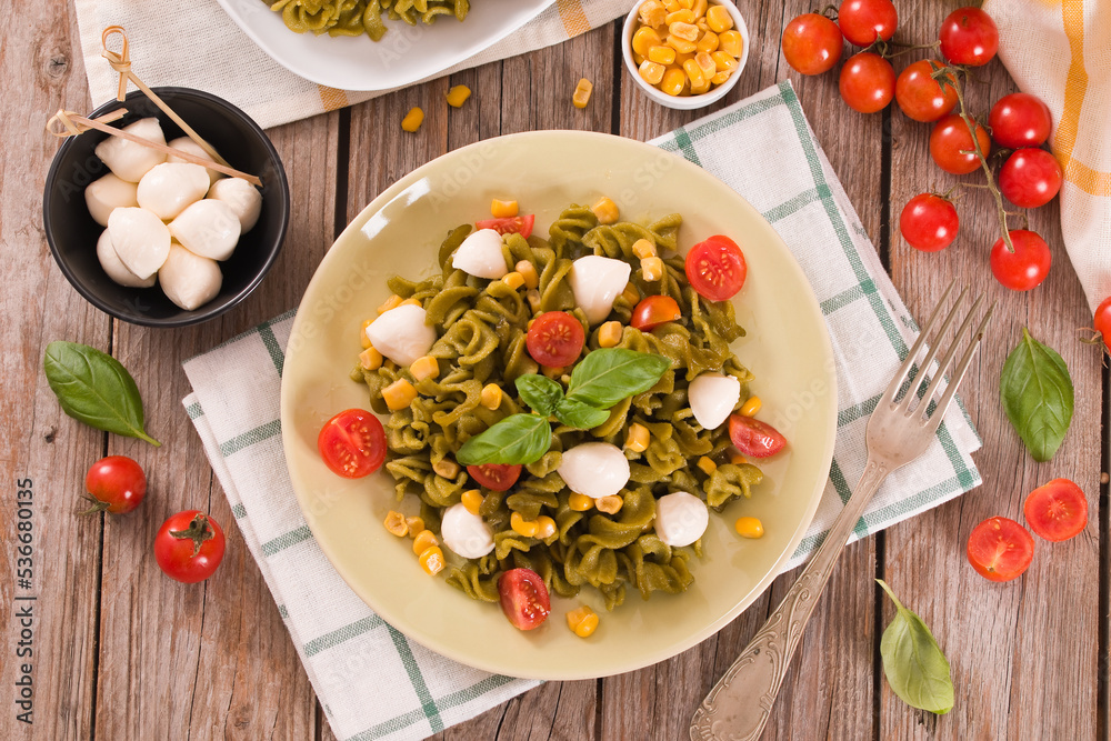 Fusilli pasta with cherry tomatoes and sweet corn. Fusilli pasta with cherry tomatoes and sweet corn.