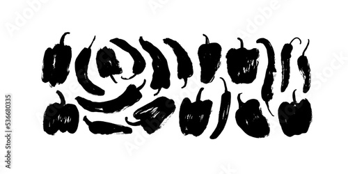 Set of hand drawn chilli peppers and capsicums. Brush drawn vector illustration isolated on white background. Sketchy silhouettes in trendy style. Black stamps of bell peppers with rough edges. 