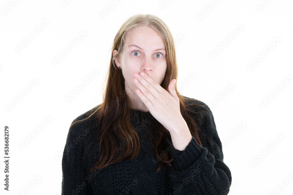 surprised outraged woman with hand over mouth posing in white background studio surprised outraged woman with hand over mouth posing in white background studio