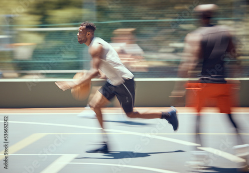 Sports, fitness and basketball man with energy running on the court for a cardio workout, training and exercise. Wellness, action or healthy black man or athlete in an active game in summer with blur