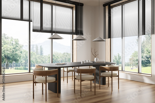 Corner view on bright dining room interior with panoramic window