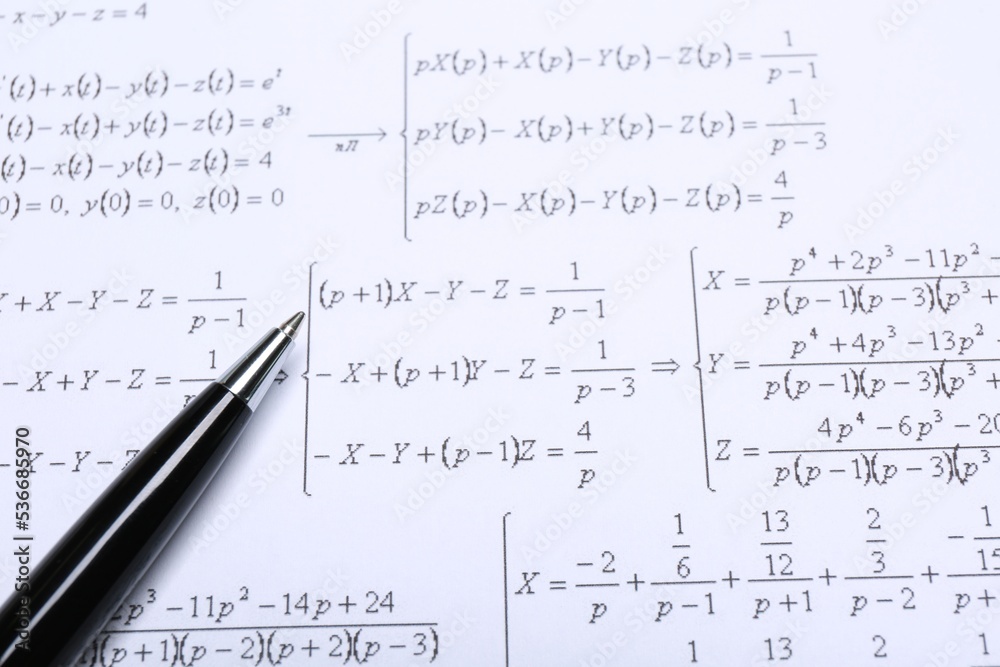 Sheet of paper with mathematical formulas and pen, closeup Sheet of paper with mathematical formulas and pen, closeup