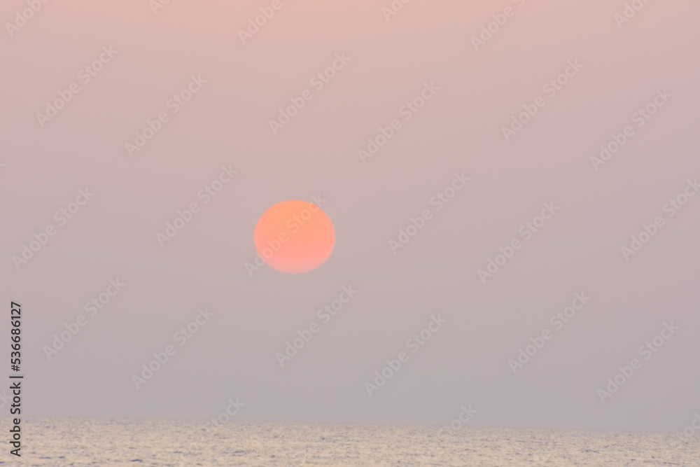 sunrise with orange warm sun at the sea on vacation in egypt detail