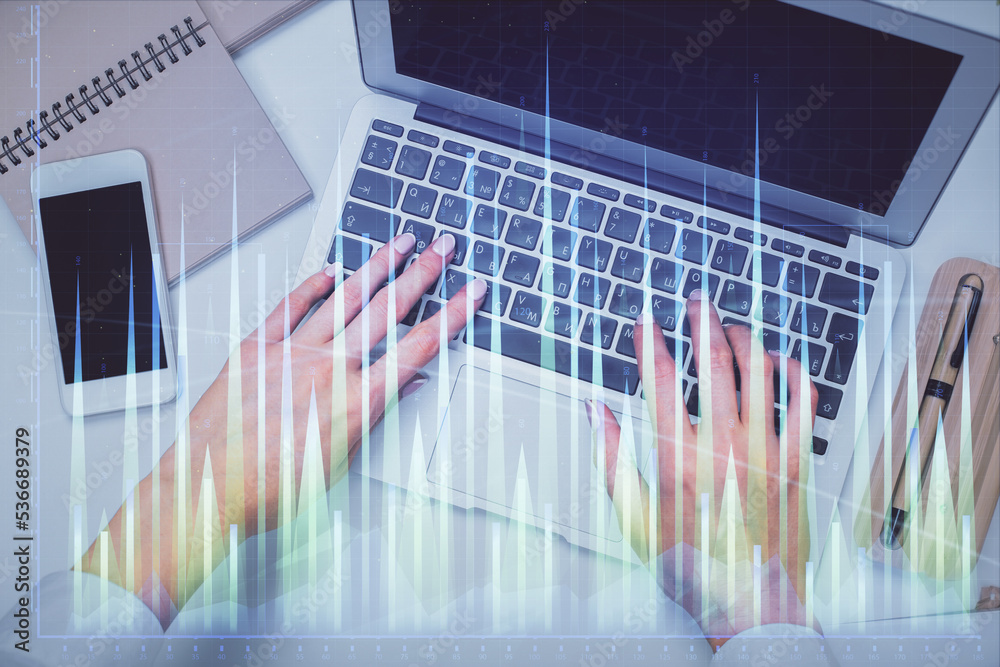 Double exposure of woman hands working on computer and forex graph hologram drawing. Top View. Financial analysis concept. Double exposure of woman hands working on computer and forex graph hologram drawing. Top View. Financial analysis concept.