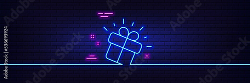 Neon light glow effect. Gift line icon. Present box sign. Brand marketing symbol. 3d line neon glow icon. Brick wall banner. Gift outline. Vector