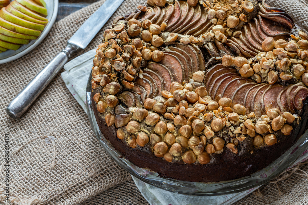 Obraz premium Moist chocolate, pear and golden hazelnut torte
