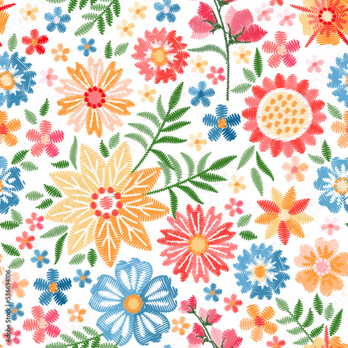 Embroidery seamless pattern with beautiful flowers. Colorful floral ornament. Fashion design. Vector embroidered illustration.