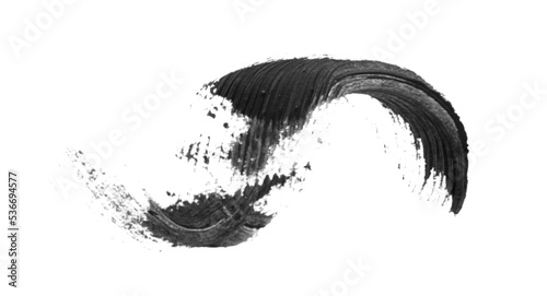Smear of black mascara for eyelashes on white background